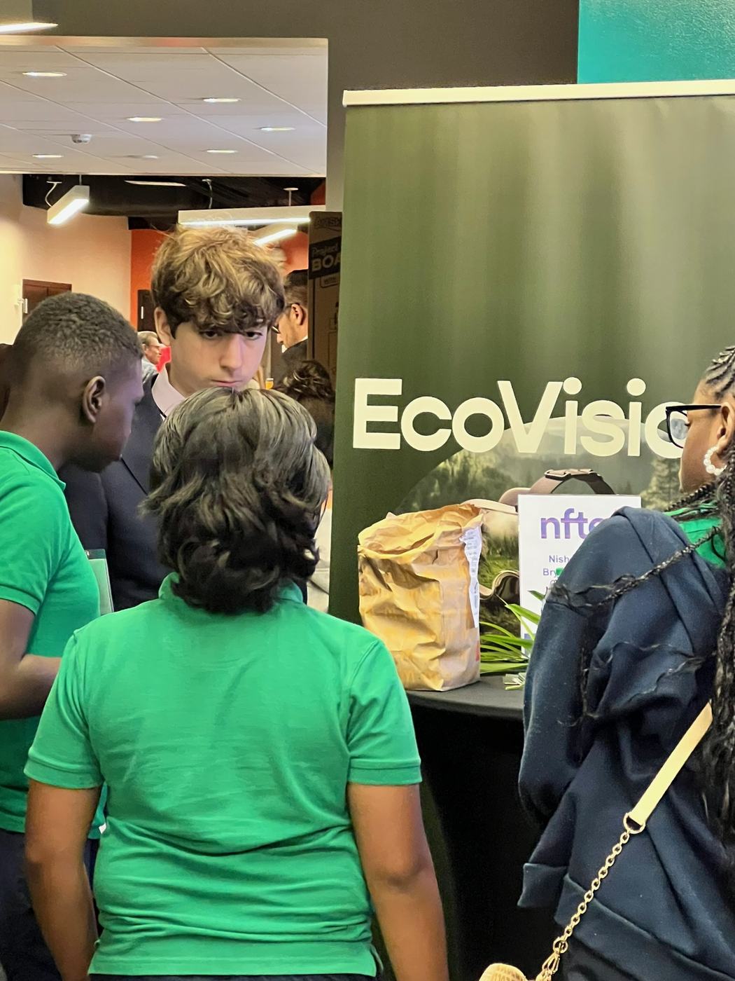 Visitors at an Ecovision booth.